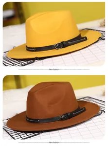 Detail of wide brim fedora hats featuring leather bands with metal buckles and rivets