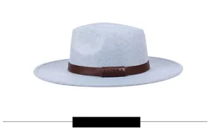 Side view of light blue wool fedora hat featuring a brown leather band with LHASA text