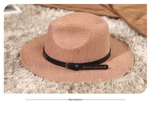 Detailed texture of khaki felt fedora hat featuring black leather band and metal buckle