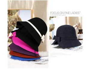 Close-up of wool felt bucket hat featuring a delicate bow tie detail in multiple colors
