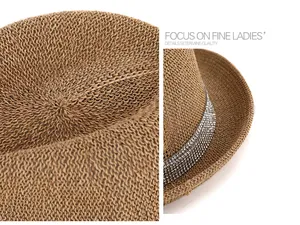 Macro shot of brown woven fedora detailing shiny rhinestone band and texture