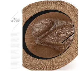 Detail of breathable straw hat interior featuring a black sweatband and fine stitching
