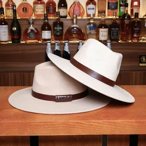 Classic beige fedora hats with leather bands displayed on a rustic wooden bar counter