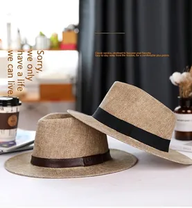 Close-up of linen Panama hats with elegant black fabric and brown leather bands