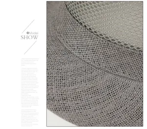 Detail view of the gray breathable mesh and fine weave texture on this summer sun hat