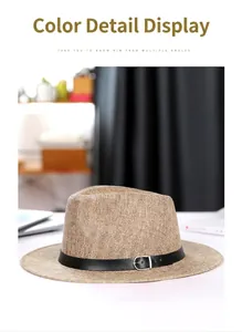 Detailed view of the woven linen texture and black leather band on this fedora hat