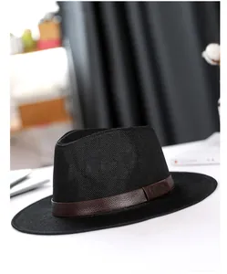 Detail of black breathable mesh fedora hat featuring a brown leather band and LHASA logo