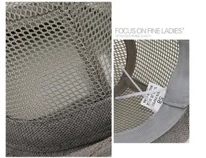 Detail of grey mesh straw hat showing breathable weave and 100% paper material label