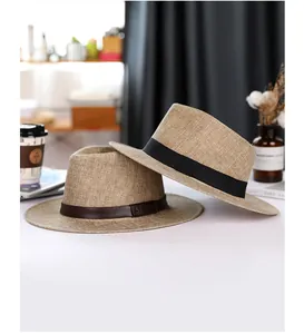 Detailed close-up of woven linen panama hats with leather and fabric decorative bands