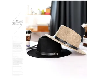 Close-up of linen Panama hats with elegant leather bands and metal buckle detail