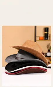 Stack of colorful wide brim suede cowboy hats in neutral tones for autumn and winter