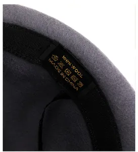 Detail view of 100% wool witch hat interior showing washing label and inner sweatband