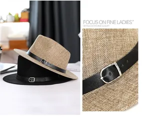 Detail of woven linen texture and leather buckle band on classic summer fedora hats