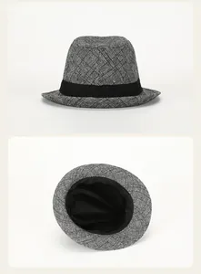 Dual view of plaid fedora hat with black ribbon, showing side profile and top interior