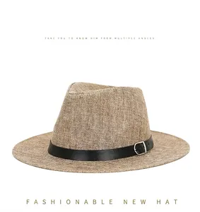 Detail of khaki linen sun hat with black leather band and silver metal buckle