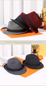 Detailed view of British style woven fedora hats in red, grey and navy blue colors