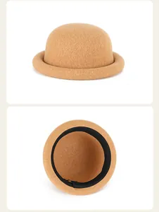 Detail view of khaki wool felt dome hat featuring a soft texture and interior sweatband