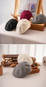 Detailed view of warm wool blend beret hats in black, red, beige and grey colors