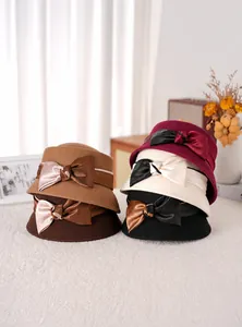 Stack of vintage wool felt dome hats with satin bows in five assorted autumn colors