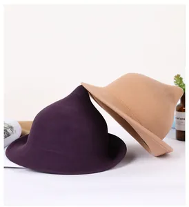 Close-up of wool witch hats in purple and khaki with curved brims on white background