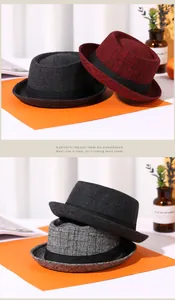 Close-up of retro British style fedora hats with plaid textures and satin ribbons