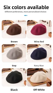 Detail view of wool beret hats in brown, wine red, gray, navy, black and off-white