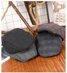 Detail van vier stijlen herenpetten met diverse winterse tweed-stoffen en verschillende texturen