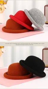 Detailed close-up of wool dome hats in red, coffee, gray, and black colors