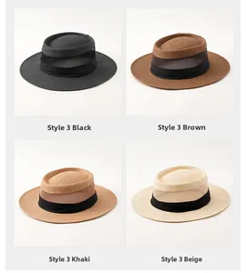 Dettaglio di cappelli di paglia a tesa larga in nero, marrone, kaki e beige mix