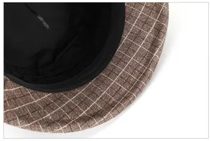 Detail of wool plaid fisherman hat showing black inner lining and reinforced sweatband