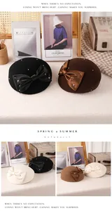 Detailed macro view showing the satin bow and sparkling rhinestone accents on wool beret hats