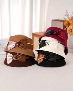 Close-up of elegant wool felt dome hat with contrast satin bow and vintage details