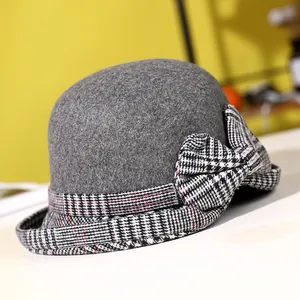 Fashionable dark grey wool felt cloche hat with a stylish houndstooth bow for winter