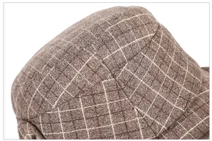 Macro shot of brown checked wool fabric texture on a warm winter fisherman hat
