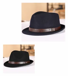 Detail of wool fedora hat with brown leather band and M-letter metal buckle hardware