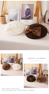 Detail of wool beret featuring satin bow and elegant pearl embellishments for women