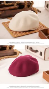 Detailed texture of retro wool octagonal beret hats in beige and burgundy colors