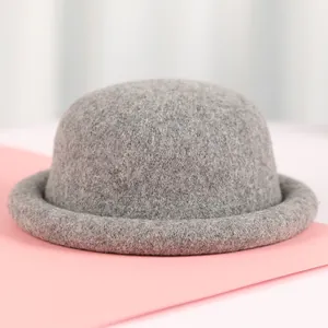 Chic grey wool knit rolled-edge bucket hat with a minimalist round top design