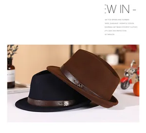 Detail of wool fedora hats with leather bands and metal M logo in vintage setting