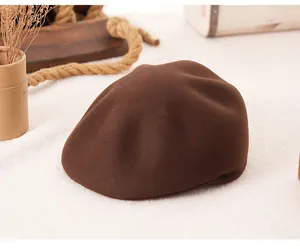 Macro shot of dark brown wool beret texture with soft waves on a cozy wool background