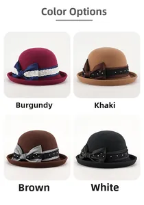 Dettaglio di cappelli in feltro di lana con fiocco in rosso vino, kaki, marrone e nero