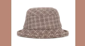Detail of coffee-colored plaid wool bucket hat with thick warm fabric for winter