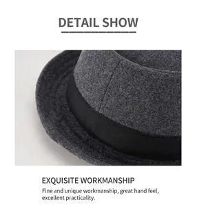 Detail shot of the dark grey wool felt hat with a black ribbed ribbon and textured brim