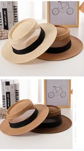 Dettaglio di un cappello di paglia con strato traspirante e nastro decorativo in seta nera