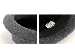 Detail view of grey wool felt hat lining with sweatband, size 58 and material labels