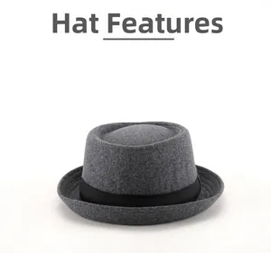 Detail view of the gray wool pork pie hat featuring a stylish black decorative ribbon band