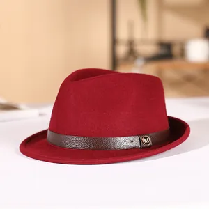 Elegant wine red wool felt fedora hat with brown leather band and gold M buckle detail
