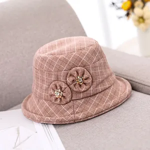 Elegant brown plaid wool fisherman hat for women with decorative fabric flowers