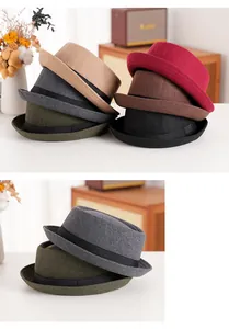 Detail view of colorful wool felt fedora hats with black ribbons for autumn and winter style