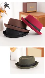 Detail view of stylish wool felt pork pie hats in multiple vintage colors for winter